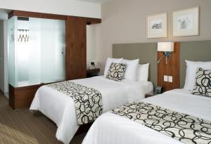 Postel nebo postele na pokoji v ubytování Casa Inn Premium Hotel Queretaro