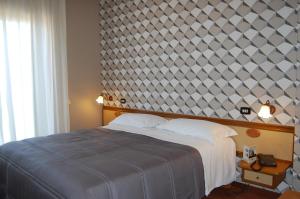 Postel nebo postele na pokoji v ubytování Hotel Ristorante Donato
