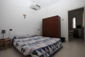 A bed or beds in a room at Apartment Lake Maggiore - ITALIA