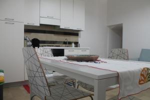 a kitchen with a table with a bowl on it at Casa Giacchino in Noto