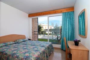 Postel nebo postele na pokoji v ubytování Hotel Port-Bo