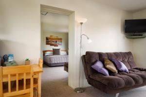 Postel nebo postele na pokoji v ubytování Longbourne Lodge Motel Mosgiel