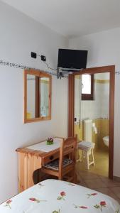 TV a/nebo společenská místnost v ubytování Trattoria Bar Pace