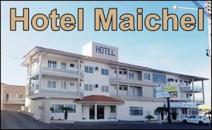 a large hotel with the words hotel malibu on top of it at Hotel Maichel in Erval Velho