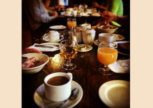 a table with plates of food and glasses of orange juice at Arlington Hotel O'Connell Bridge in Dublin