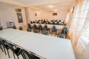 a conference room with tables and chairs in it at Pansion Maglica in Međugorje