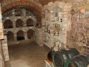 a room with a bunch of wine bottles in a building at Pension Černý jezdec in Lednice