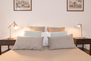 A bed or beds in a room at Gondola Verde VeniseJeTaime