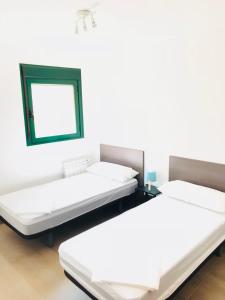 Ein Bett oder Betten in einem Zimmer der Unterkunft Apartamentos Deluxe Benicasim