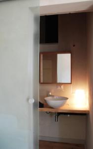 a bathroom with a white sink and a mirror at San Rocco in Turin