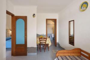 Кровать или кровати в номере Azzurromare Residence