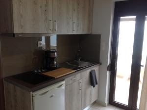 Kuchyň nebo kuchyňský kout v ubytování Eva Rooms