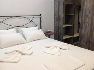 Postel nebo postele na pokoji v ubytování Eva Rooms