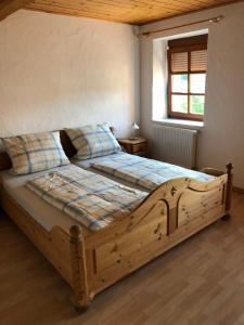 מיטה או מיטות בחדר ב-Ferienhaus Werkhof