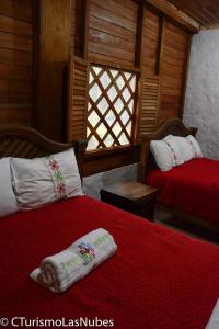 Łóżko lub łóżka w pokoju w obiekcie Ecolodge Las Nubes Chiapas