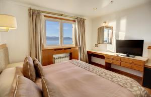 TV a/nebo společenská místnost v ubytování Hotel Tres Reyes