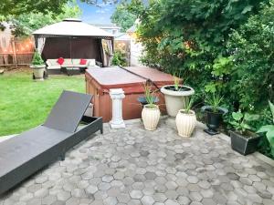 a backyard with a hot tub and a gazebo at Co-ed Dorm with Fantastic Patio! in Ewing