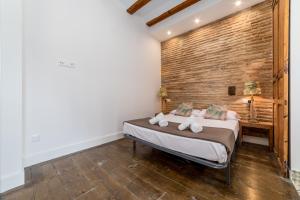 Postel nebo postele na pokoji v ubytování My Loft 4 You Ruzafa Style II