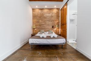 Postel nebo postele na pokoji v ubytování My Loft 4 You Ruzafa Style II