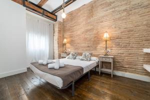 Postel nebo postele na pokoji v ubytování My Loft 4 You Ruzafa Style II
