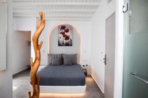 A bed or beds in a room at Mina Studios