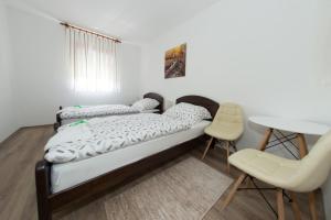Postel nebo postele na pokoji v ubytování Kuća za odmor Marija