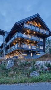 a large building with balconies on the side of it at Naava Chalet First Floor in Ähtäri