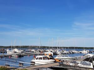 a bunch of boats docked in a marina at Klintvägen Apartments in Mariehamn