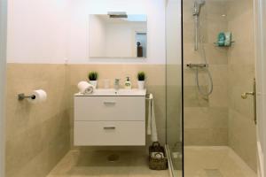 a bathroom with a sink and a shower at appartement gelegen aan de golfbaan op La Quinta Benahavis Marbella in Benahavís +28 photos