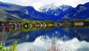 a large body of water with mountains in the background at Columbine Cabins in Grand Lake