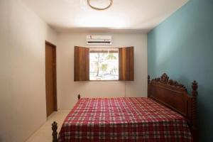 Cama o camas de una habitación en Casa de Praia Mico Leão