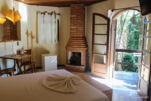 Cama ou camas em um quarto em Hotel da Cachoeira