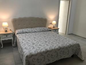 Postel nebo postele na pokoji v ubytování MarMè