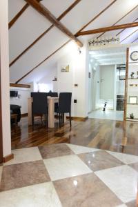 a living room with a checkered floor at Apartman Rustik in Belgrade