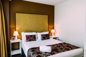 Cama o camas de una habitación en The Quadrant Hotel & Suites