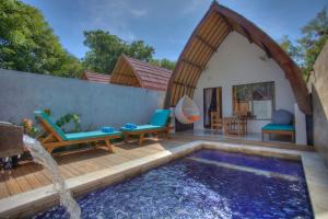 a backyard with a swimming pool and a house at Villa Hoomea Private Pool - Adults Only in Gili Islands