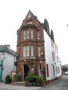 a building on the corner of a street at The Famous Star Hotel Moffat in Moffat