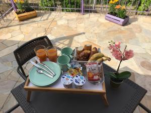 a table with a tray of food on a patio at La Beverita in Ventimiglia
