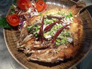 a plate of food with a salad on it at JJ Beach Resort & JJ Seafood in Ko Phayam