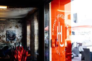 a window of a store with umbrellas in it at The Henry Jones Art Hotel in Hobart +25 photos