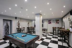 a billiard room with a pool table and a bar at Hanchi Hostel in Istanbul