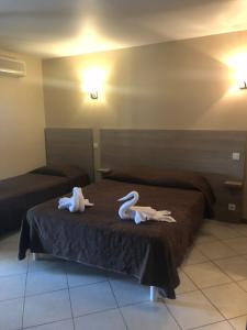 Postel nebo postele na pokoji v ubytování Hotel Clair de Lune
