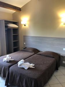 Postel nebo postele na pokoji v ubytování Hotel Clair de Lune