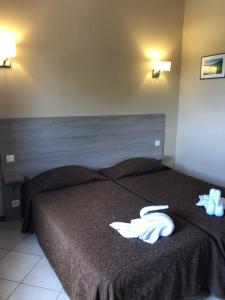 Postel nebo postele na pokoji v ubytování Hotel Clair de Lune