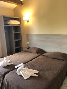 Postel nebo postele na pokoji v ubytování Hotel Clair de Lune