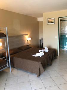 Postel nebo postele na pokoji v ubytování Hotel Clair de Lune