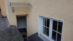 a building with a large window and a door at FEWO Lohmar in Lohmar