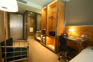 Postel nebo postele na pokoji v ubytování IND Hotel