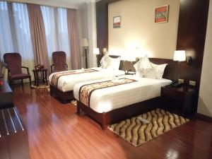Postel nebo postele na pokoji v ubytování Sherar Addis Hotel