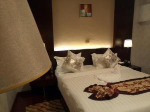 Postel nebo postele na pokoji v ubytování Sherar Addis Hotel